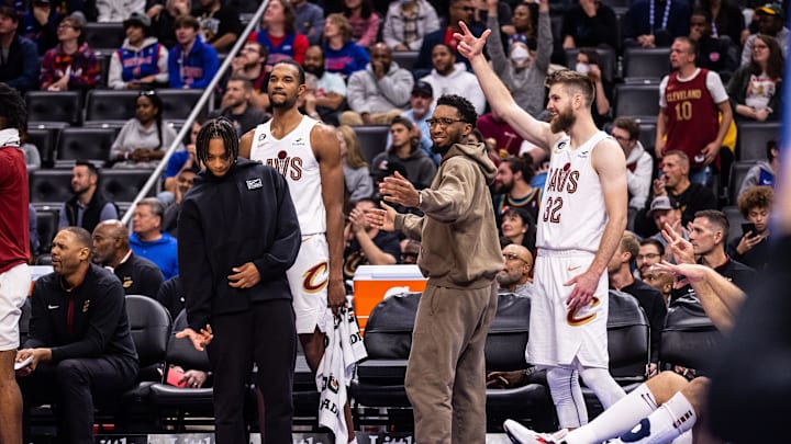 Nov 4, 2022; Detroit, Michigan, USA; Cleveland Cavaliers guard Darius Garland (10), forward Evan Mobley (4), guard Donovan Mitchell (45) and forward Dean Wade (32) celebrate a made 3-pointer by Cleveland Cavaliers forward Kevin Love (not pictured) against the Detroit Pistons in the second quarter at Little Caesars Arena. Mandatory Credit: Allison Farrand-Imagn Images
