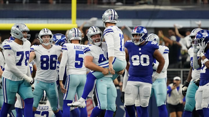 Sep 14, 2025; Arlington, Texas, USA; Dallas Cowboys long snapper Trent Sieg (44) lifts up place kicker Brandon Aubrey (17) after his game-winning field goal against the New York Giants during overtime at AT&T Stadium.  