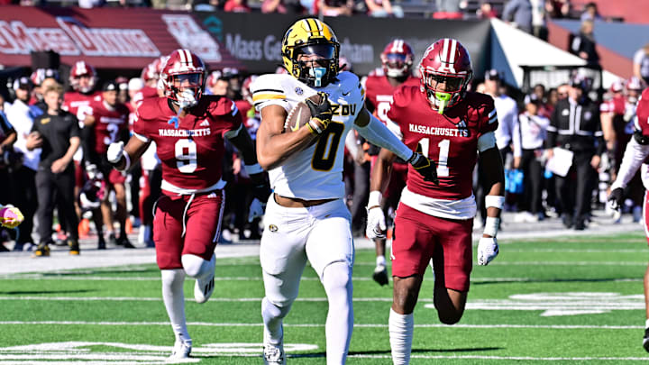 Oct 12, 2024; Amherst, Massachusetts, USA; Missouri Tigers wide receiver Joshua Manning (0)  runs the ball against the Massachusetts Minutemen during the second half at Warren McGuirk Alumni Stadium. Mandatory Credit: Eric Canha-Imagn Images