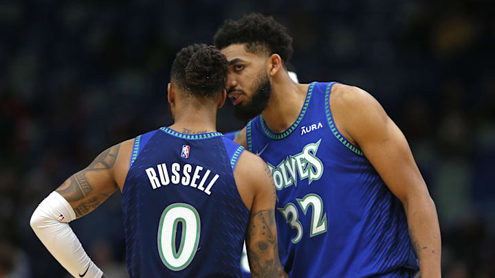 Jan 11, 2022; New Orleans, Louisiana, USA; Minnesota Timberwolves guard D'Angelo Russell (0) and center Karl-Anthony Towns (32) talk in the second quarter against the New Orleans Pelicans at the Smoothie King Center. Mandatory Credit: Chuck Cook-Imagn Images Jan 11, 2022; New Orleans, Louisiana, USA; Minnesota Timberwolves guard D'Angelo Russell (0) and center Karl-Anthony Towns (32) talk in the second quarter against the New Orleans Pelicans at the Smoothie King Center. Mandatory Credit: Chuck Cook-Imagn Images