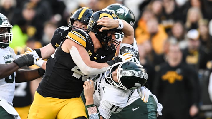 Nov 22, 2025; Iowa City, Iowa, USA; Iowa Hawkeyes defensive end Max Llewellyn (48) rushes Michigan State Spartans quarterback Alessio Milivojevic (11) during the second quarter at Kinnick Stadium. Mandatory Credit: Jeffrey Becker-Imagn Images