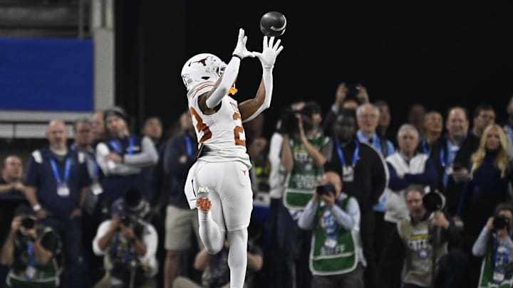 Jan 10, 2025; Arlington, Texas, USA; Texas Longhorns running back Jaydon Blue (23) makes a touchdown catch during the third quarter of the College Football Playoff semifinal against the Ohio State Buckeyes in the Cotton Bowl at AT&T Stadium. Mandatory Credit: Jerome Miron-Imagn Images