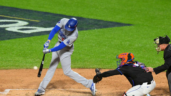 Oct 16, 2024; New York City, New York, USA; Los Angeles Dodgers first base Freddie Freeman (5) hits a single against the New York Mets in the fifth inning during game three of the NLCS for the 2024 MLB playoffs at Citi Field. Mandatory Credit: John Jones-Imagn Images Oct 16, 2024; New York City, New York, USA; Los Angeles Dodgers first base Freddie Freeman (5) hits a single against the New York Mets in the fifth inning during game three of the NLCS for the 2024 MLB playoffs at Citi Field. Mandatory Credit: John Jones-Imagn Images