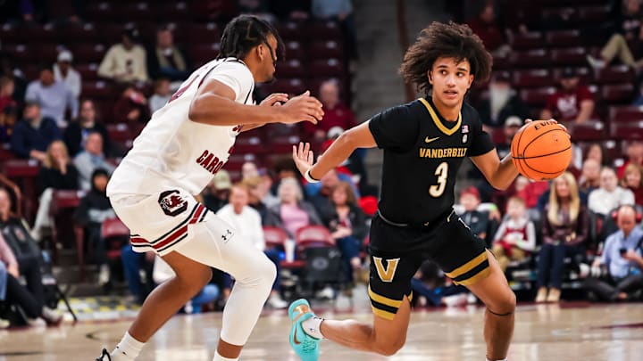 Jan 3, 2026; Columbia, South Carolina, USA; Vanderbilt Commodores guard Tyler Tanner (3) drives around South Carolina Gamecocks guard Kobe Knox (4) in the second half at Colonial Life Arena. Mandatory Credit: Jeff Blake-Imagn Images