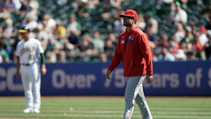 Sep 5, 2019; Oakland, CA, USA; Los Angeles Angels manager Brad Ausmus (12) walks towards the mound Sep 5, 2019; Oakland, CA, USA; Los Angeles Angels manager Brad Ausmus (12) walks towards the mound