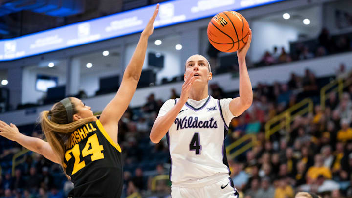 Kansas State Wildcats guard Serena Sundell (4) goes for a lay up while being guarded by Iowa Hawkeyes guard Gabbie Marshall (24) during the first quarter of the Gulf Coast Showcase championship game at Hertz Arena in Estero on Sunday, Nov. 26, 2023.