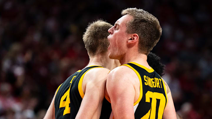 Mar 9, 2025; Lincoln, Nebraska, USA; Iowa Hawkeyes forward Payton Sandfort (20) and guard Josh Dix (4) celebrate during the second half against the Nebraska Cornhuskers at Pinnacle Bank Arena. Mandatory Credit: Dylan Widger-Imagn Images