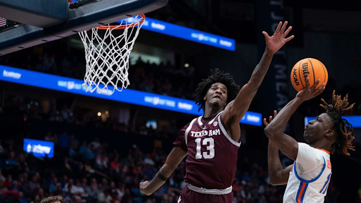 Florida Gators guard Denzel Aberdeen (11) shoots with Texas A&M Aggies forward Solomon
