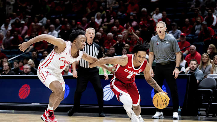 Nov 26, 2024; Las Vegas, Nevada, USA; Alabama Crimson Tide Guard Aden Holloway fends of Houston Cougar guard L.J. Cryer (4) during the second half at MGM Grand Garden Arena. Mandatory Credit: Jeffrey (Tyge) O'Donnell-Imagn Images Nov 26, 2024; Las Vegas, Nevada, USA; Alabama Crimson Tide Guard Aden Holloway fends of Houston Cougar guard L.J. Cryer (4) during the second half at MGM Grand Garden Arena. Mandatory Credit: Jeffrey (Tyge) O'Donnell-Imagn Images