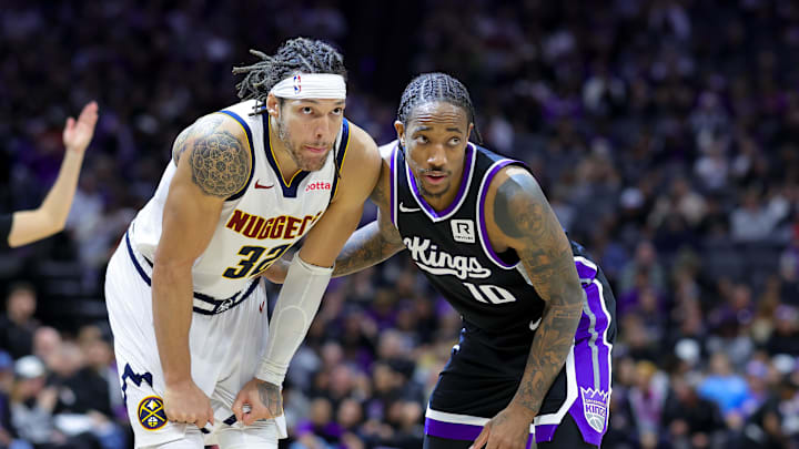 Dec 16, 2024; Sacramento, California, USA; Denver Nuggets forward Aaron Gordon (32) and Sacramento Kings forward DeMar DeRozan (10) during the second quarter at Golden 1 Center. Mandatory Credit: Sergio Estrada-Imagn Images
