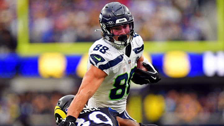 Nov 16, 2025; Inglewood, California, USA; Seattle Seahawks tight end AJ Barner (88) runs with the ball against Los Angeles Rams cornerback Josh Wallace (30) during the second half at SoFi Stadium. Mandatory Credit: Gary A. Vasquez-Imagn Images