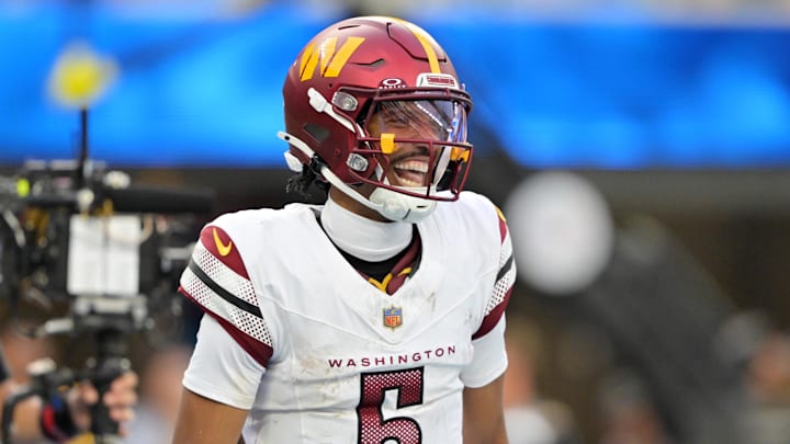 Oct 5, 2025; Inglewood, California, USA; Washington Commanders quarterback Jayden Daniels (5) celebrates after a touchdown against the Los Angeles Chargers in the second half at SoFi Stadium. Mandatory Credit: Jayne Kamin-Oncea-Imagn Images