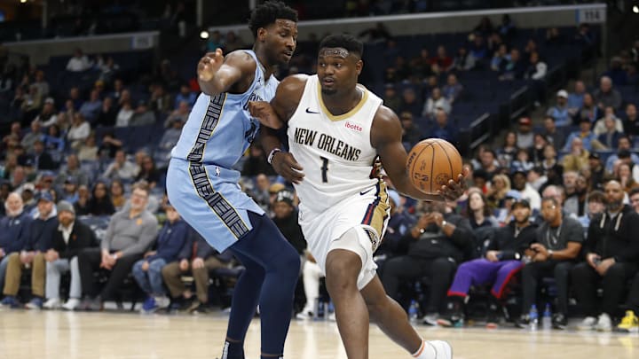 Feb 12, 2024; Memphis, Tennessee, USA; New Orleans Pelicans forward Zion Williamson (1) drives to the basket as Memphis Grizzlies forward-center Jaren Jackson Jr. (13) defends during the second half at FedExForum. Mandatory Credit: Petre Thomas-Imagn Images