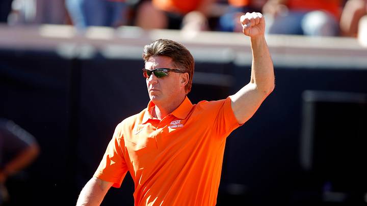 Oklahoma State coach Mike Gundy gestures to the crowd before last year's game against Texas at Boone