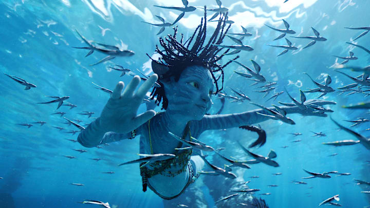 Tuk (Trinity Bliss) in 20th Century Studios' AVATAR: THE WAY OF WATER. Photo courtesy of 20th Century Studios. © 2022 20th Century Studios. All Rights Reserved.