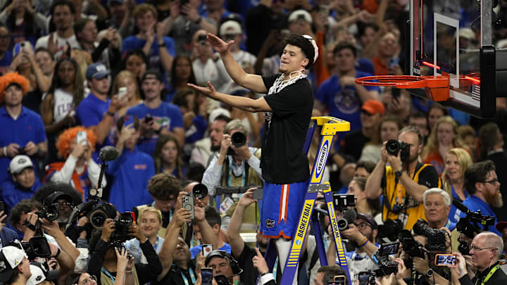 Apr 7, 2025; San Antonio, TX, USA; Florida Gators guard Walter Clayton Jr. (1) cuts the net after defeating the Houston Cougars in the national championship game of the Final Four of the 2025 NCAA Tournament at the Alamodome. Mandatory Credit: Scott Wachter-Imagn Images