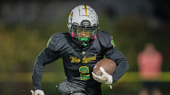 Northland's Amir Brown (2) runs the ball down the field during their game against Big Walnut at Northland High School.