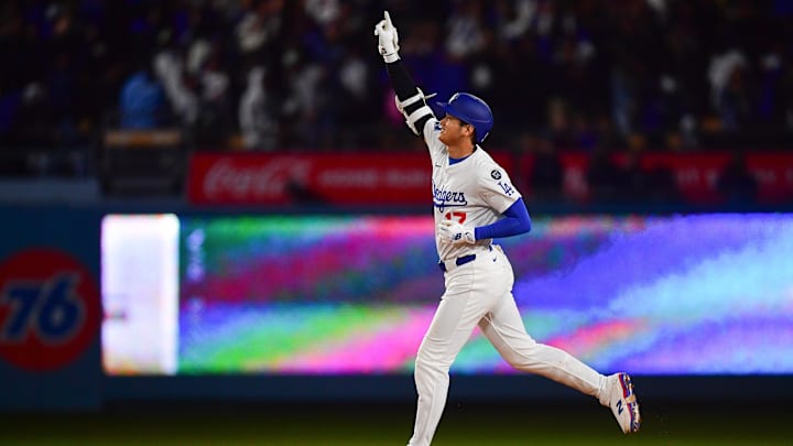 Apr 2, 2025; Los Angeles, California, USA; Los Angeles Dodgers designated hitter Shohei Ohtani (17) rounds the bases after hitting a walk off solo home run against the Atlanta Braves during the ninth inning at Dodger Stadium. Mandatory Credit: Gary A. Vasquez-Imagn Images