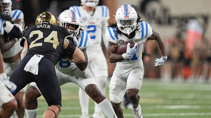 Sep 14, 2024; Winston-Salem, North Carolina, USA; Mississippi Rebels running back Henry Parrish Jr. (21) runs up the middle against the Wake Forest Demon Deacons during the second half at Allegacy Federal Credit Union Stadium. Mandatory Credit: Jim Dedmon-Imagn Images Sep 14, 2024; Winston-Salem, North Carolina, USA; Mississippi Rebels running back Henry Parrish Jr. (21) runs up the middle against the Wake Forest Demon Deacons during the second half at Allegacy Federal Credit Union Stadium. Mandatory Credit: Jim Dedmon-Imagn Images