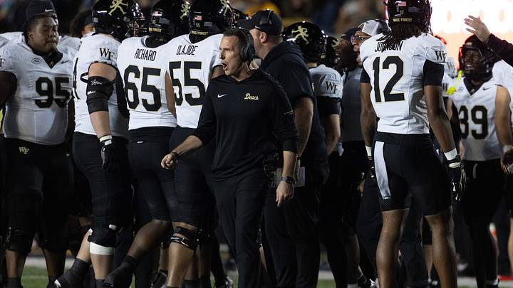 Oct 17, 2026; Berkeley, California, USA;  Wake Forest Demon Deacons head coach Jake Dickert (center) talks to his players during a time out in the first quarter against the California Golden Bears at California Memorial Stadium.  Mandatory Credit: D. Ross Cameron-Imagn Images