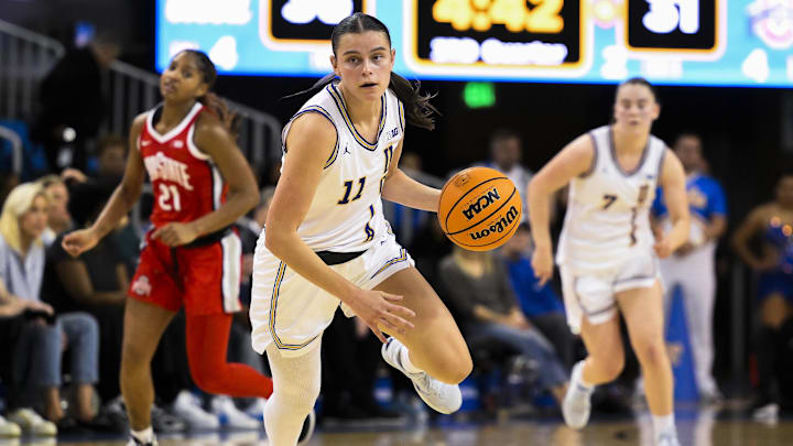 Feb 5, 2025; Los Angeles, California, USA; UCLA Bruins guard Gabriela Jaquez (11) pushes the ball up the court during the third quarter against the Ohio State Buckeyes at Pauley Pavilion presented by Wescom. Mandatory Credit: Robert Hanashiro-Imagn Images