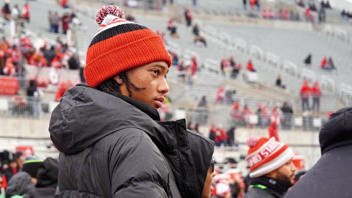 Recruit Chris Henry Jr. watches Ohio State warm up prior to the Buckeyes' game against Indiana.

Chris Henry Jr