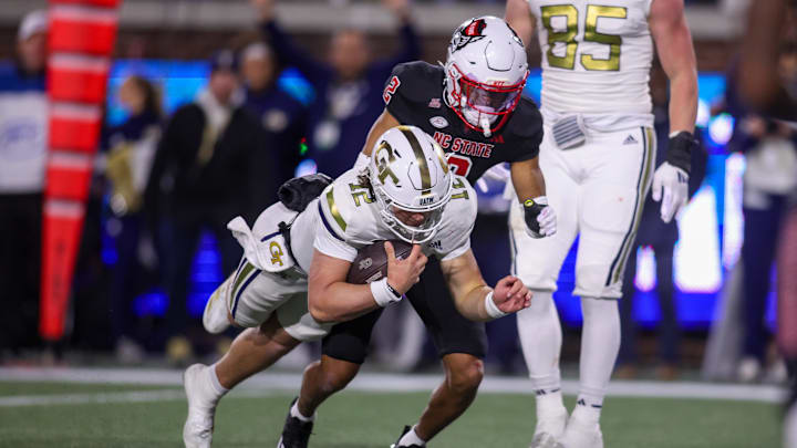Nov 21, 2024; Atlanta, Georgia, USA; Georgia Tech Yellow Jackets quarterback Aaron Philo (12) dives for a touchdown against the North Carolina State Wolfpack in the fourth quarter at Bobby Dodd Stadium at Hyundai Field. Mandatory Credit: Brett Davis-Imagn Images