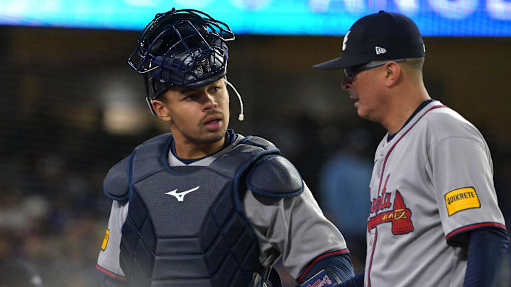 Atlanta Braves catcher Drake Baldwin talks with relief pitcher Jesse Chavez.