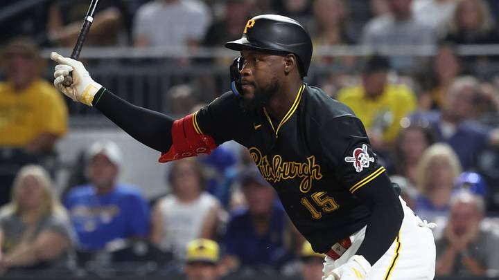 Sep 16, 2026; Pittsburgh, Pennsylvania, USA;  Pittsburgh Pirates center fielder Oneil Cruz (15) hits an infield  single against the Milwaukee Brewers during the seventh inning at PNC Park.  Mandatory Credit: Charles LeClaire-Imagn Images