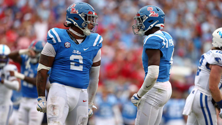 Sep 28, 2024; Oxford, Mississippi, USA; Mississippi Rebels defensive linemen Walter Nolen (2) and linebacker Suntarine Perkins (4) react after a sack during the second half against the Kentucky Wildcats at Vaught-Hemingway Stadium. Mandatory Credit: Petre Thomas-Imagn Images
