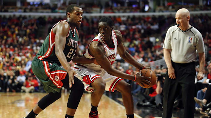 Apr 27, 2015; Chicago, IL, USA; Chicago Bulls forward Tony Snell (20) is defended by Milwaukee Bucks guard Khris Middleton (22) in game five of the first round of the 2015 NBA Playoffs at United Center. The Bucks won 94-88. Mandatory Credit: Kamil Krzaczynski-Imagn Images
