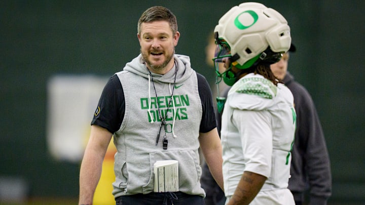 Oregon head coach Dan Lanning walks the field during an open practice ahead of the Orange Bowl at the Moshofsky Center in Eugene, Oregon on Dec. 27, 2025. Oregon head coach Dan Lanning walks the field during an open practice ahead of the Orange Bowl at the Moshofsky Center in Eugene, Oregon on Dec. 27, 2025.