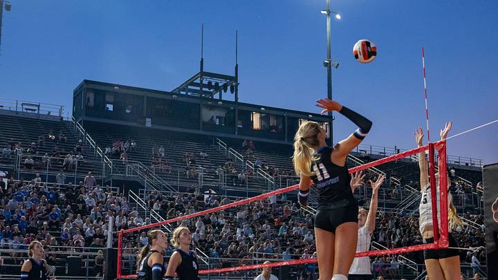 Piper Ladwig of Waukee Northwest spikes the ball as during a match with Ankeny Centennial to open the volleyball season under the lights at Valley Stadium in West Des Moines, Thursday, August 27, 2026. Piper Ladwig of Waukee Northwest spikes the ball as during a match with Ankeny Centennial to open the volleyball season under the lights at Valley Stadium in West Des Moines, Thursday, August 27, 2026.