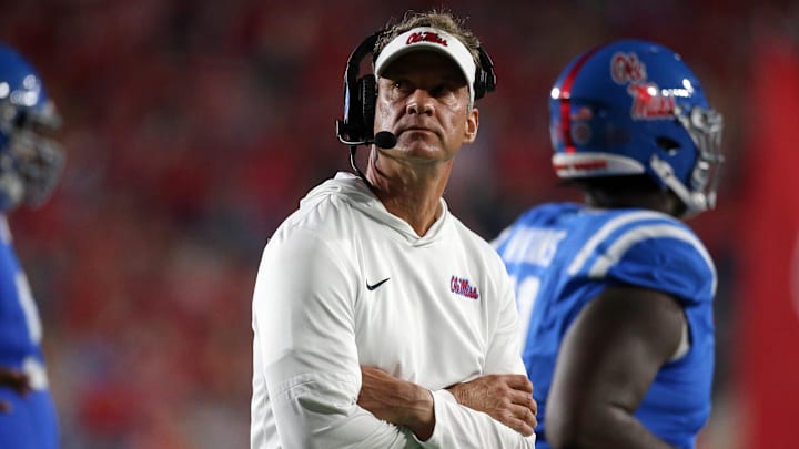 Nov 15, 2025; Oxford, Mississippi, USA; Mississippi Rebels head coach Lane Kiffin looks on during a time out during the first quarter against the Florida Gators at Vaught-Hemingway Stadium. Mandatory Credit: Petre Thomas-Imagn Images Nov 15, 2025; Oxford, Mississippi, USA; Mississippi Rebels head coach Lane Kiffin looks on during a time out during the first quarter against the Florida Gators at Vaught-Hemingway Stadium. Mandatory Credit: Petre Thomas-Imagn Images