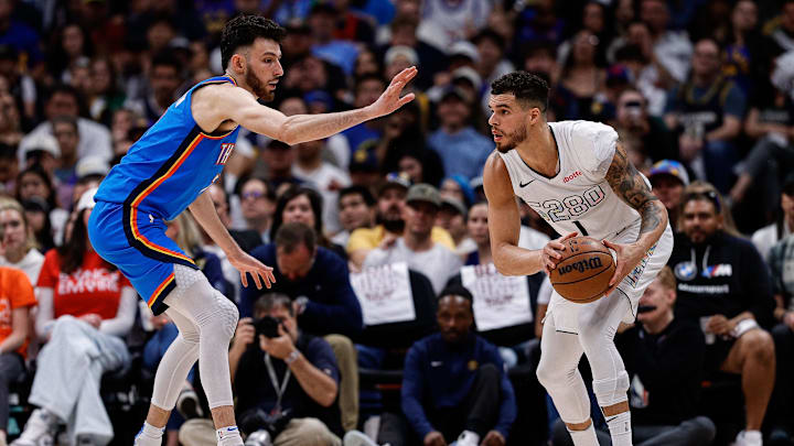 May 15, 2025; Denver, Colorado, USA; Denver Nuggets forward Michael Porter Jr. (1) controls the ball as Oklahoma City Thunder forward Chet Holmgren (7) guards in the second quarter during game six of the second round for the 2025 NBA Playoffs at Ball Arena. Mandatory Credit: Isaiah J. Downing-Imagn Images May 15, 2025; Denver, Colorado, USA; Denver Nuggets forward Michael Porter Jr. (1) controls the ball as Oklahoma City Thunder forward Chet Holmgren (7) guards in the second quarter during game six of the second round for the 2025 NBA Playoffs at Ball Arena. Mandatory Credit: Isaiah J. Downing-Imagn Images
