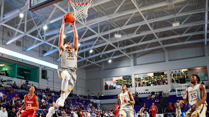 Montverde Academy Eagles guard Dante Allen (30) goes to dunk the ball during the fourth quarter of the first round of the 51st annual City of Palms Classic against the Archbishop Carroll Patriots at Suncoast Credit Union Arena in Fort Myers, Fla., on Wednesday, Dec. 18, 2024.