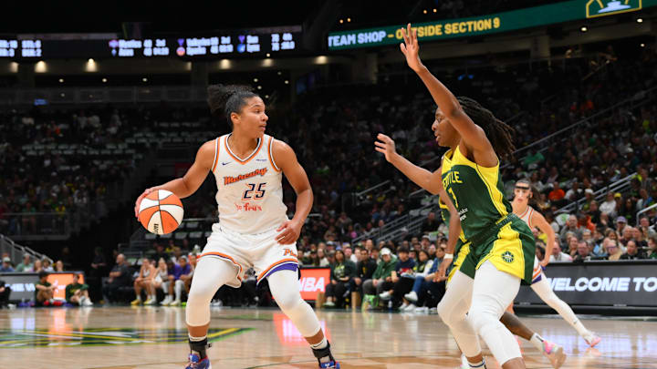 May 23, 2025; Seattle, Washington, USA; Phoenix Mercury forward Alyssa Thomas (25) dribbles the ball while defended by Seattle Storm forward Nneka Ogwumike (3) during the second half at Climate Pledge Arena. Mandatory Credit: Steven Bisig-Imagn Images