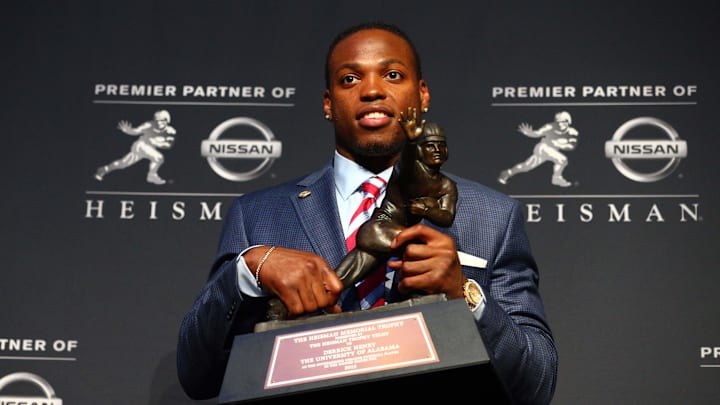 Dec 12, 2015; New York, NY, USA; Alabama running back Derrick Henry poses with the Heisman Trophy during a press conference at the New York Marriott Marquis after winning the trophy during the 81st annual Heisman Trophy presentation. Mandatory Credit: Brad Penner-Imagn Images