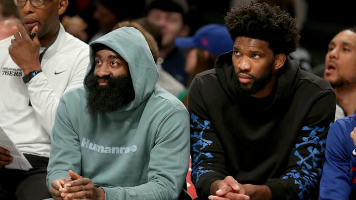 Oct 3, 2022; Brooklyn, New York, USA; Philadelphia 76ers guard James Harden (left) and Philadelphia 76ers center Joel Embiid watch from the bench during the second quarter against the Brooklyn Nets at Barclays Center. Mandatory Credit: Brad Penner-Imagn Images Oct 3, 2022; Brooklyn, New York, USA; Philadelphia 76ers guard James Harden (left) and Philadelphia 76ers center Joel Embiid watch from the bench during the second quarter against the Brooklyn Nets at Barclays Center. Mandatory Credit: Brad Penner-Imagn Images
