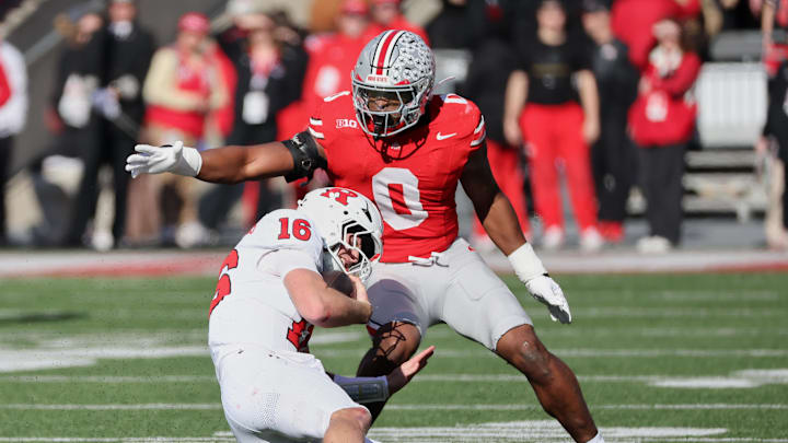 Nov 22, 2025; Columbus, Ohio, USA; Ohio State Buckeyes linebacker Sonny Styles (0) tackles Rutgers Scarlet Knights quarterback Athan Kaliakmanis (16) during the first quarter at Ohio Stadium. Mandatory Credit: Joseph Maiorana-Imagn Images