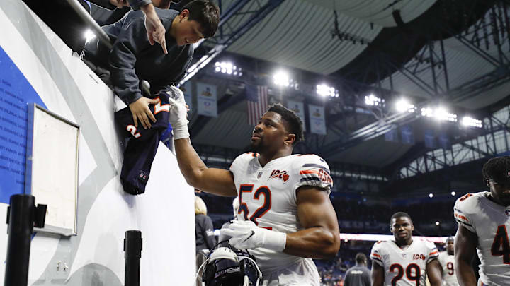 Khalil Mack signs a jersey for a fan during his first run with the Bears. Fans will treat him the same away but his role changes a bit this time.