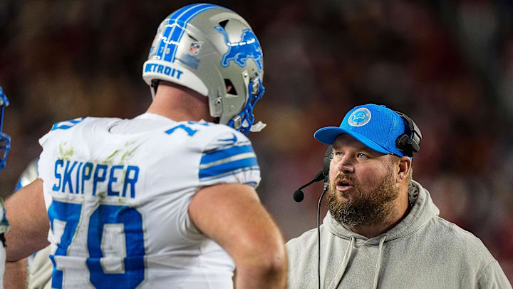 Detroit Lions offensive tackle Dan Skipper (70) talks to offensive line coach Hank Fraley during the second half against San Francisco 49ers at Levi's Stadium in Santa Clara, Calif. on Monday, Dec. 30, 2024.