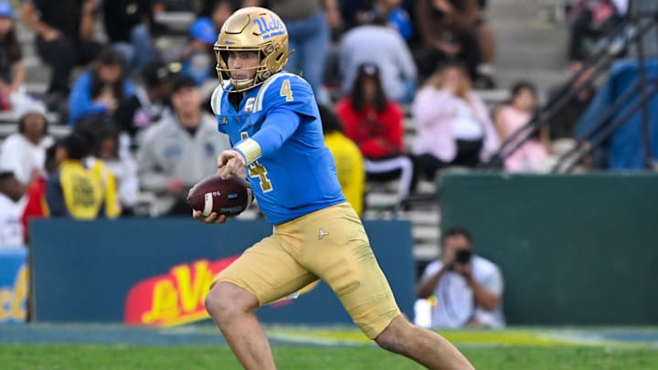 Nov 30, 2024; Pasadena, California, USA; UCLA Bruins quarterback Ethan Garbers (4) scrambles out of the pocket during the third quarter against the Fresno State Bulldogs at Rose Bowl. Mandatory Credit: Robert Hanashiro-Imagn Images