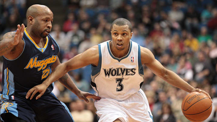 Feb 5, 2011; Minneapolis, MN, USA; Minnesota Timberwolves guard Sebastian Telfair (3) dribbles around Denver Nuggets guard Anthony Carter (25) during the second half at Target Center. The Nuggets won 113-100. Mandatory Credit: Jesse Johnson-Imagn Images