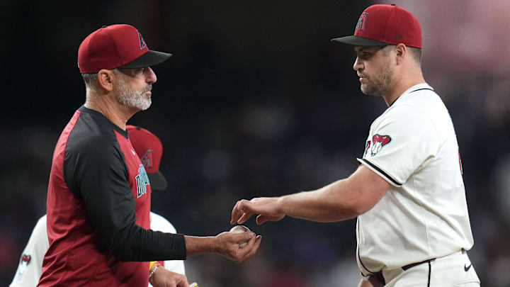 Arizona Diamondbacks left-hander Jalen Beeks (68) hands the ball to manager Torey Lovullo as he is pulled from the game against the Miami Marlins at Chase Field on Saturday, June 28, 2025. Arizona Diamondbacks left-hander Jalen Beeks (68) hands the ball to manager Torey Lovullo as he is pulled from the game against the Miami Marlins at Chase Field on Saturday, June 28, 2025.