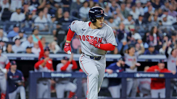 Sep 30, 2025; Bronx, New York, USA; Boston Red Sox outfielder Masataka Yoshida (7) hits a two run single during the seventh inning against the New York Yankees during game one of the Wildcard round for the 2025 MLB playoffs at Yankee Stadium. Mandatory Credit: Brad Penner-Imagn Images Sep 30, 2025; Bronx, New York, USA; Boston Red Sox outfielder Masataka Yoshida (7) hits a two run single during the seventh inning against the New York Yankees during game one of the Wildcard round for the 2025 MLB playoffs at Yankee Stadium. Mandatory Credit: Brad Penner-Imagn Images