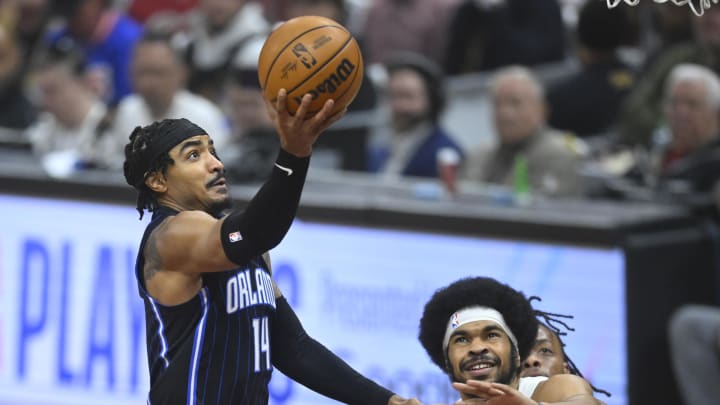 Apr 22, 2024; Cleveland, Ohio, USA; Orlando Magic guard Gary Harris (14) drives to the basket beside