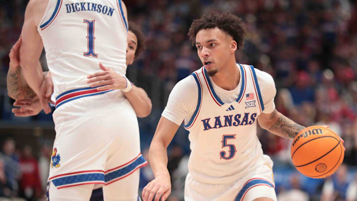 Kansas Jayhawks guard Zeke Mayo (5) drive the ball around center Hunter Dickinson (1) in the second half of the Sunflower Showdown game against the Kansas State Wildcats inside Allen Fieldhouse Saturday, Jan. 18, 2025.