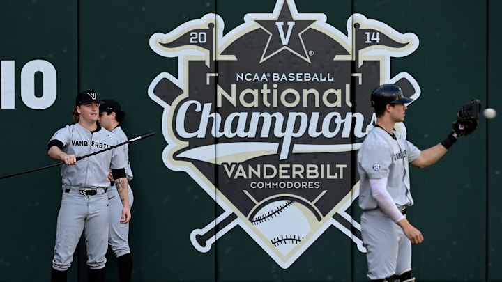 Vanderbilt pitcher Sawyer Hawks, left, warms ups before a NCAA college baseball game against Tennessee Tech at Hawkins Field Tuesday, Feb. 25, 2025, in Nashville, Tenn.