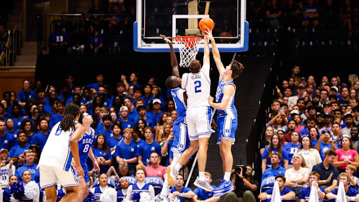 Oct 4, 2024; Durham, NC, USA; Duke Blue Devils center Stanley Borden (52) blocks guard Cooper Flagg (2) dunk during Countdown to Craziness at Cameron Indoor Stadium. Mandatory Credit: Jaylynn Nash-Imagn Images